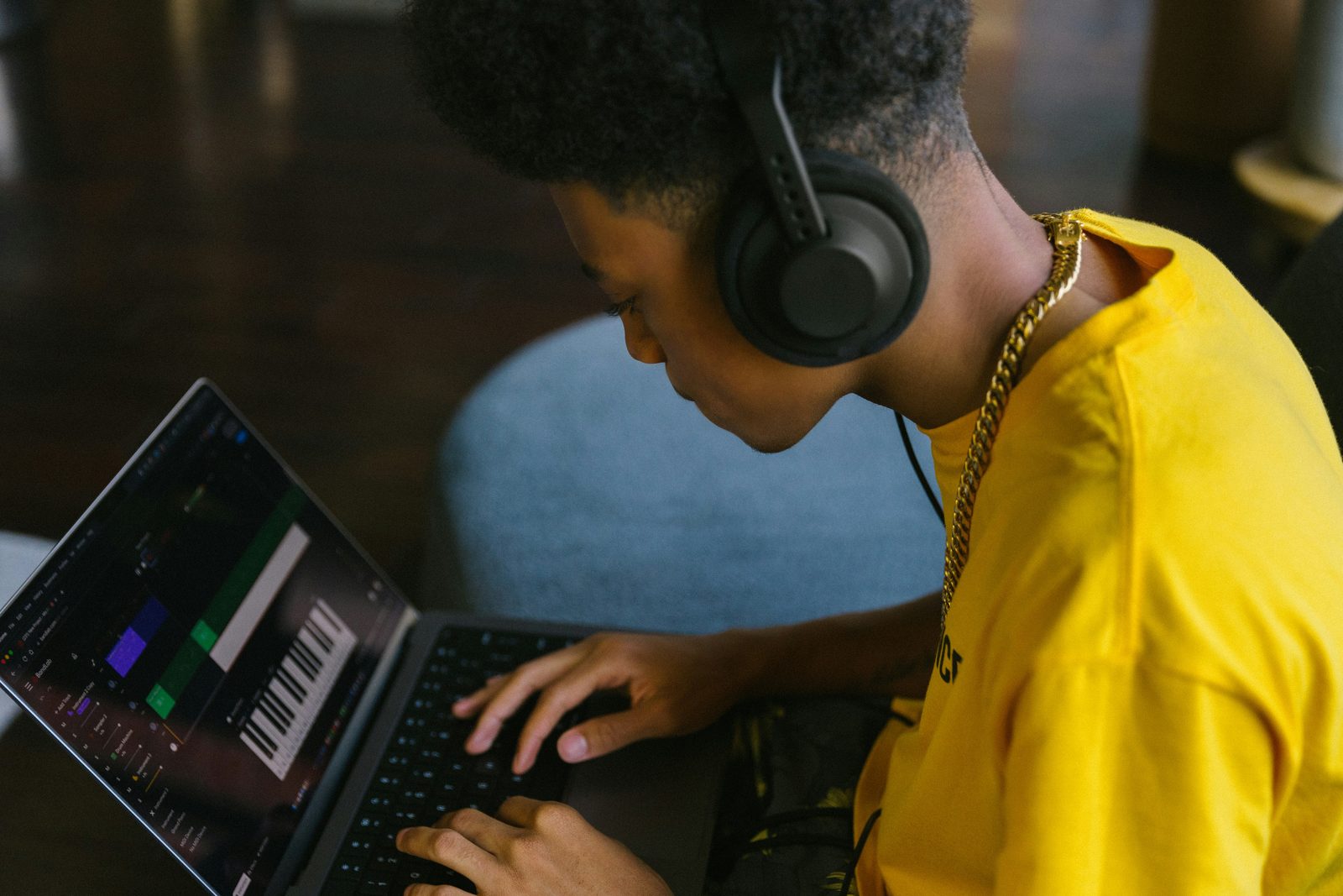 Creator using a laptop to prepare media for audio extraction
